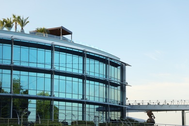 Modern building with tinted windows against sky. Urban architecture