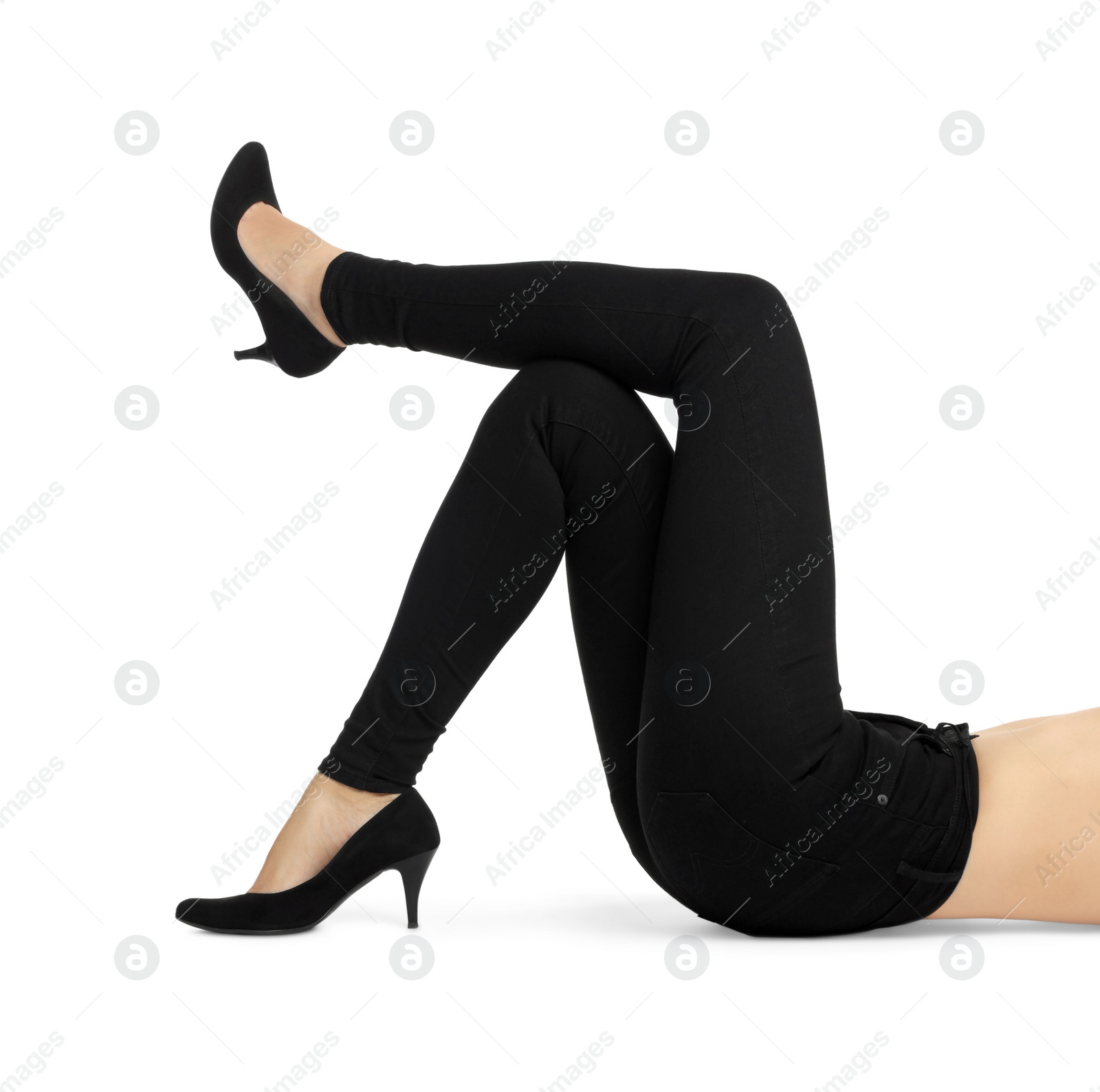 Photo of Woman wearing stylish black jeans and high heels shoes on white background, closeup