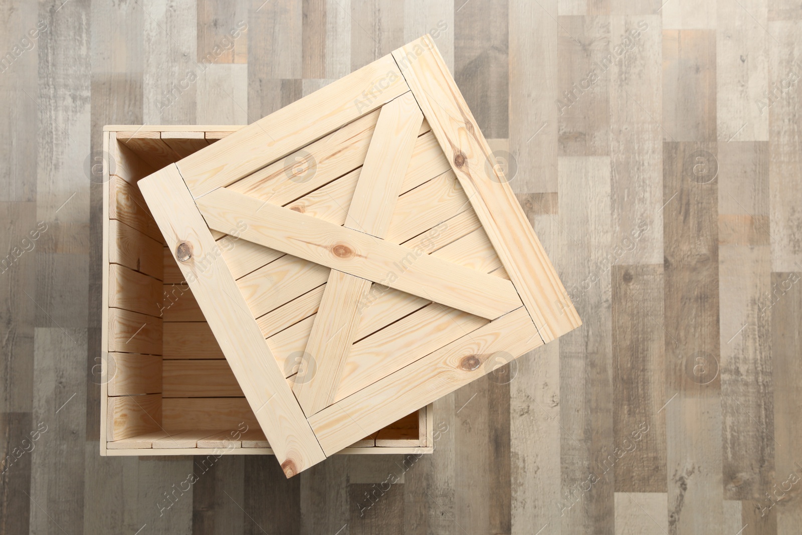 Photo of Wooden crate on floor, top view. Space for text