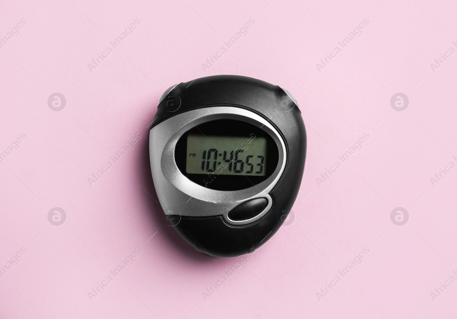 Photo of Digital timer on pink background, top view