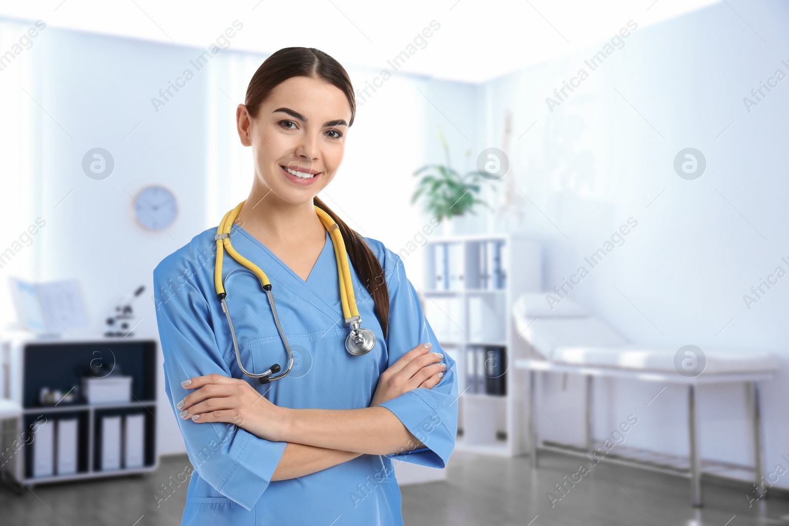 Image of Nurse with stethoscope in uniform at hospital