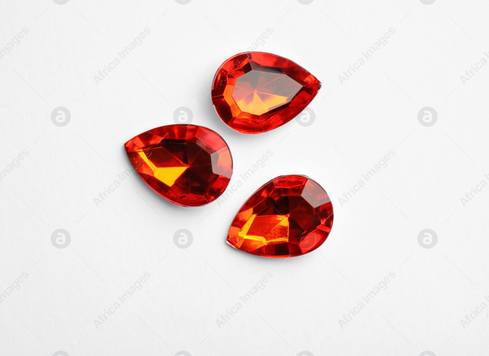 Image of Beautiful gemstones on white background, top view