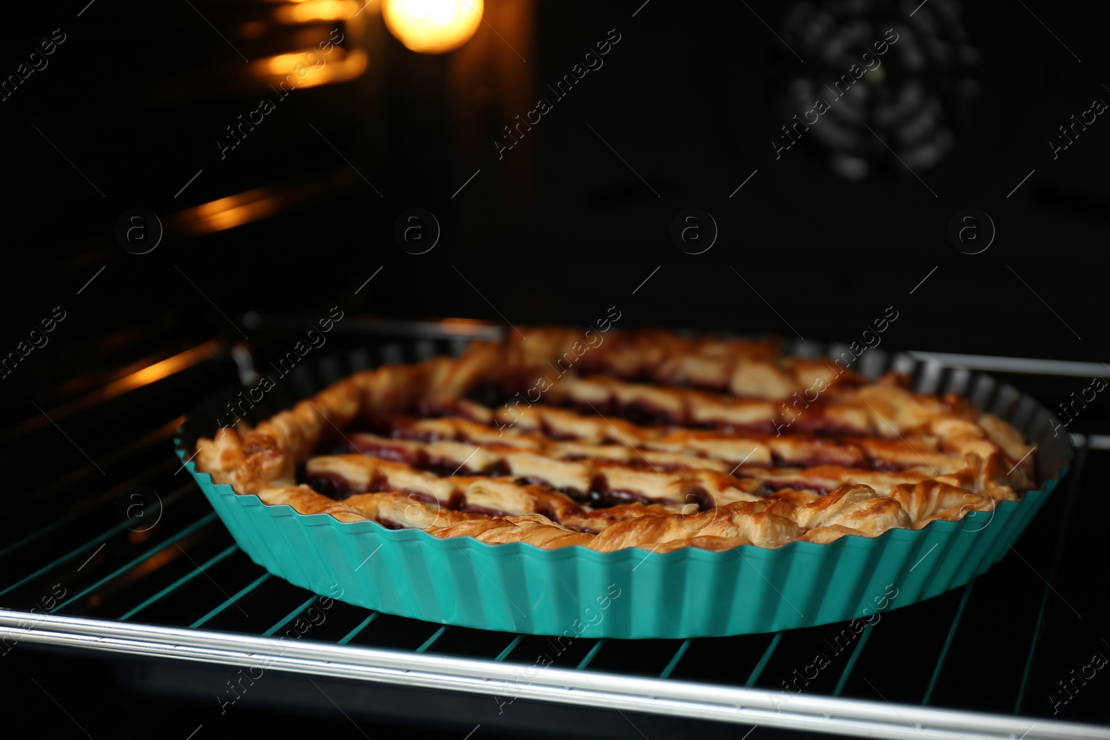 Photo of Delicious fresh homemade cake in oven, closeup