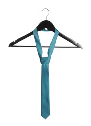 Hanger with light blue necktie isolated on white