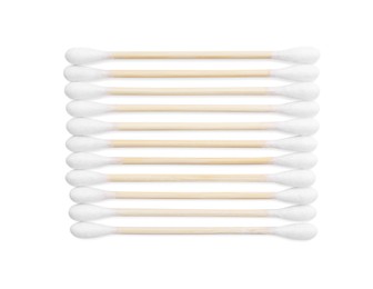 Photo of Wooden cotton buds on white background, top view