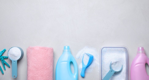 Photo of Flat lay composition with laundry detergent on light background, space for text