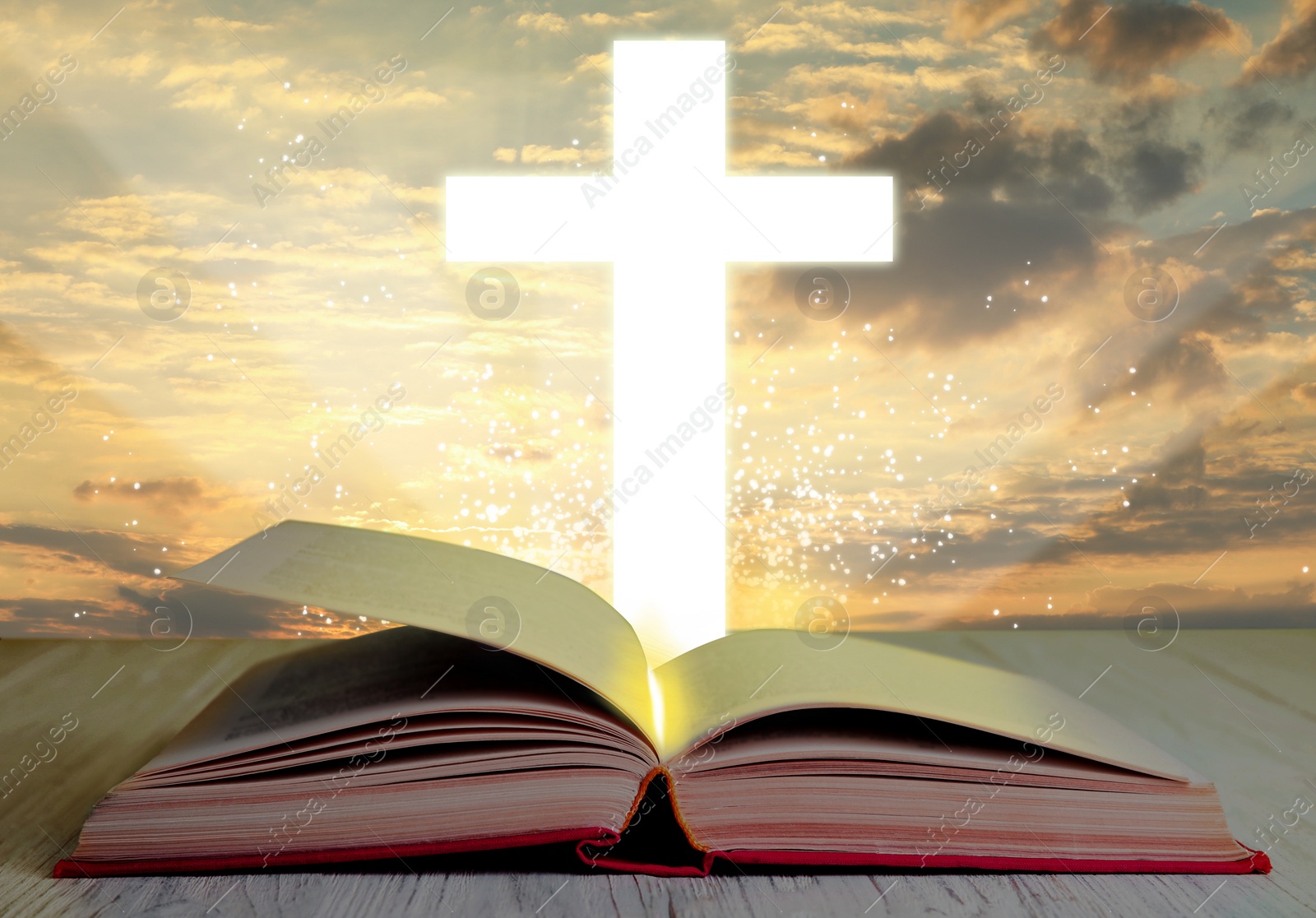 Image of Silhouette of cross and open Bible on white wooden table at sunrise