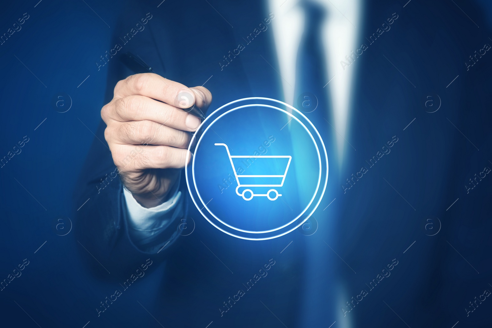 Image of Man pointing at icon of shopping cart on virtual screen, closeup. Online store