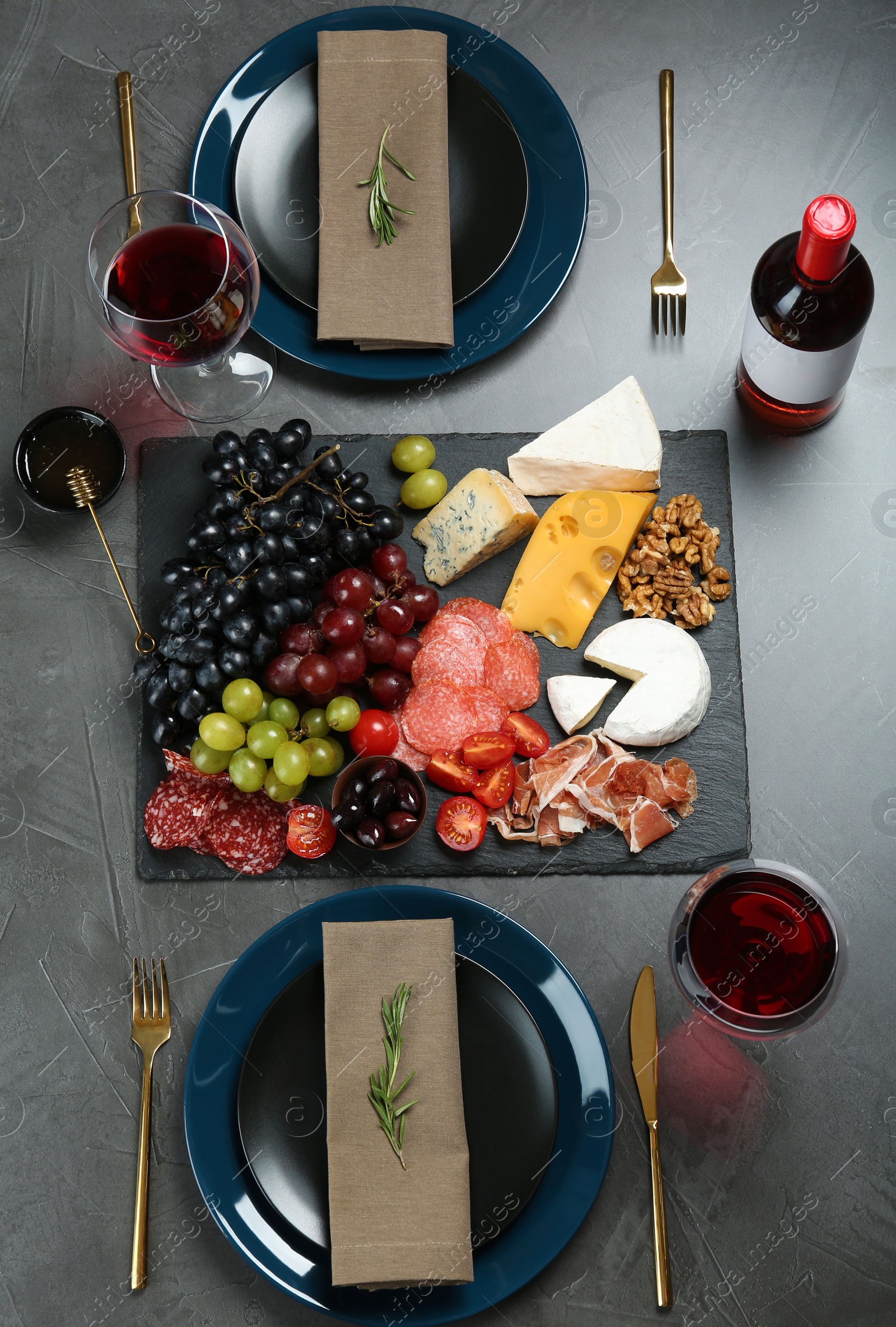 Photo of Wine and snacks served for dinner on table in restaurant, flat lay