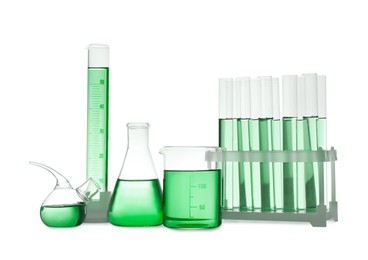 Image of Laboratory glassware with green liquid isolated on white