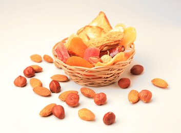 Photo of Mixed dried fruits and nuts on white background