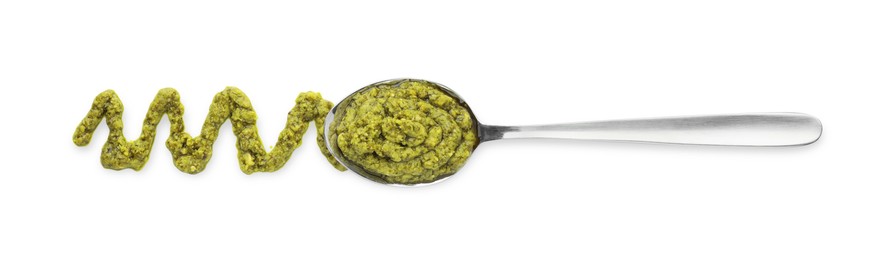 Tasty pesto sauce and spoon isolated on white, top view