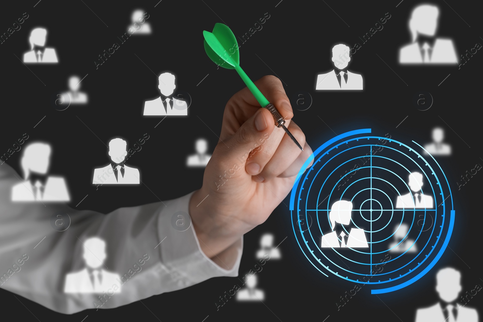 Image of Executive search (headhunting). Woman aiming with dart to digital human icons on dark background, closeup