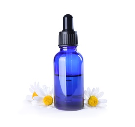 Photo of Bottle of chamomile essential oil and flowers isolated on white