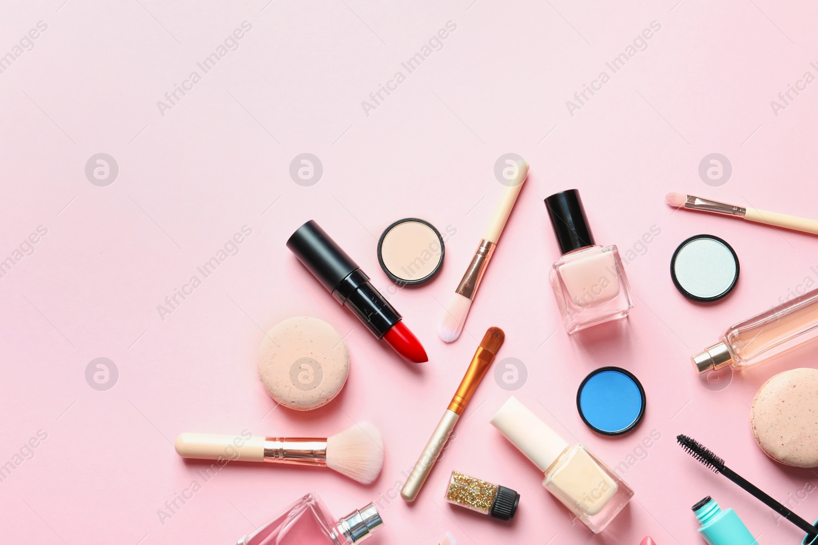 Photo of Flat lay composition with decorative cosmetics on color background