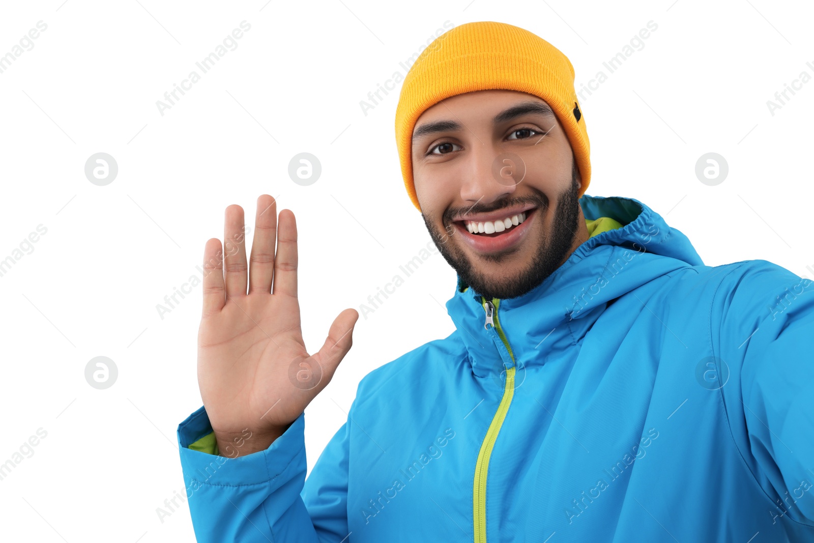 Photo of Smiling young man taking selfie on white background