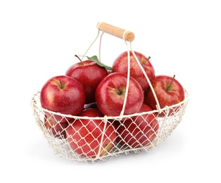 Photo of Metal basket of ripe juicy red apples with leaf on white background