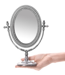 Photo of Woman holding vintage mirror against white background