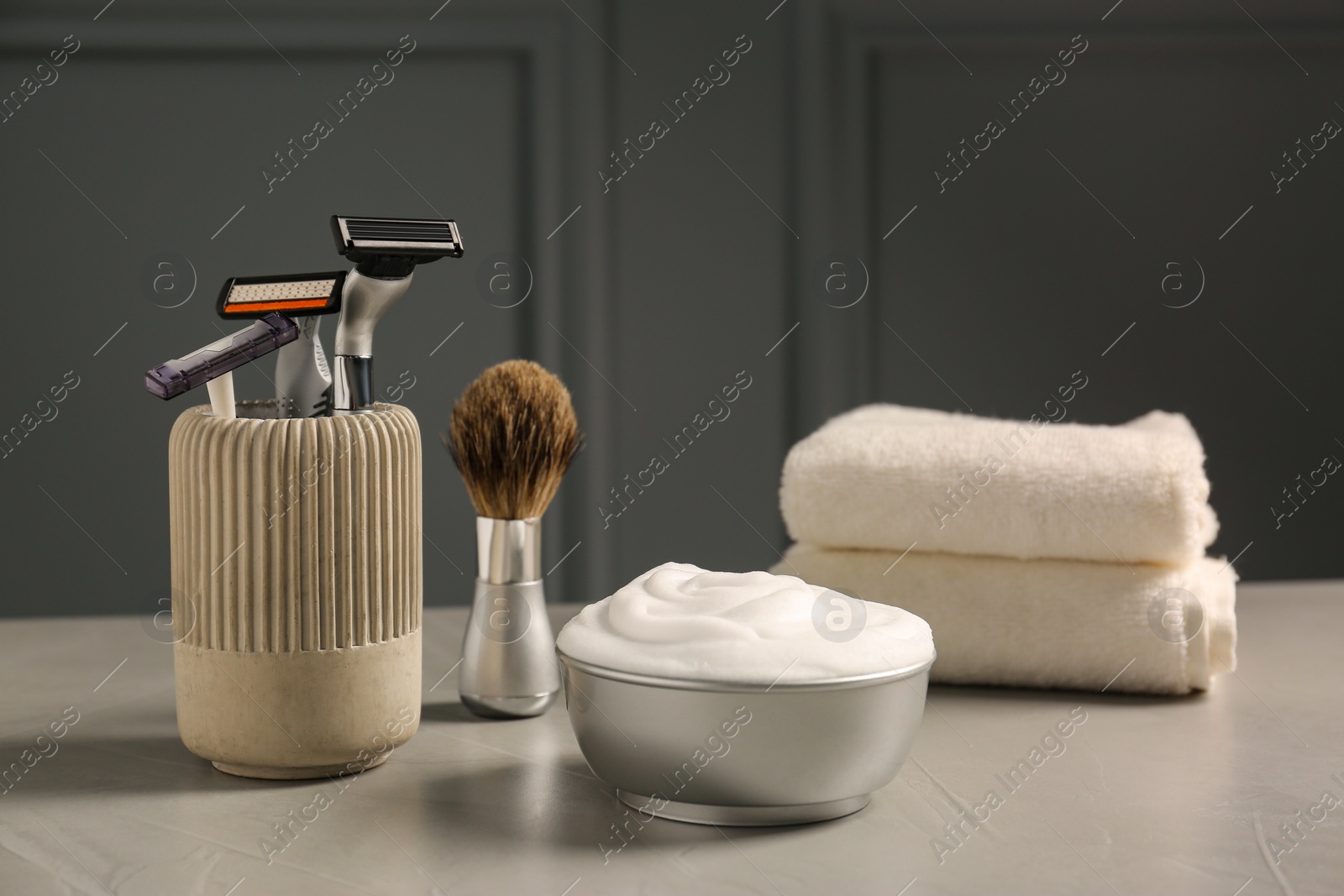 Photo of Set of men's shaving tools on grey table