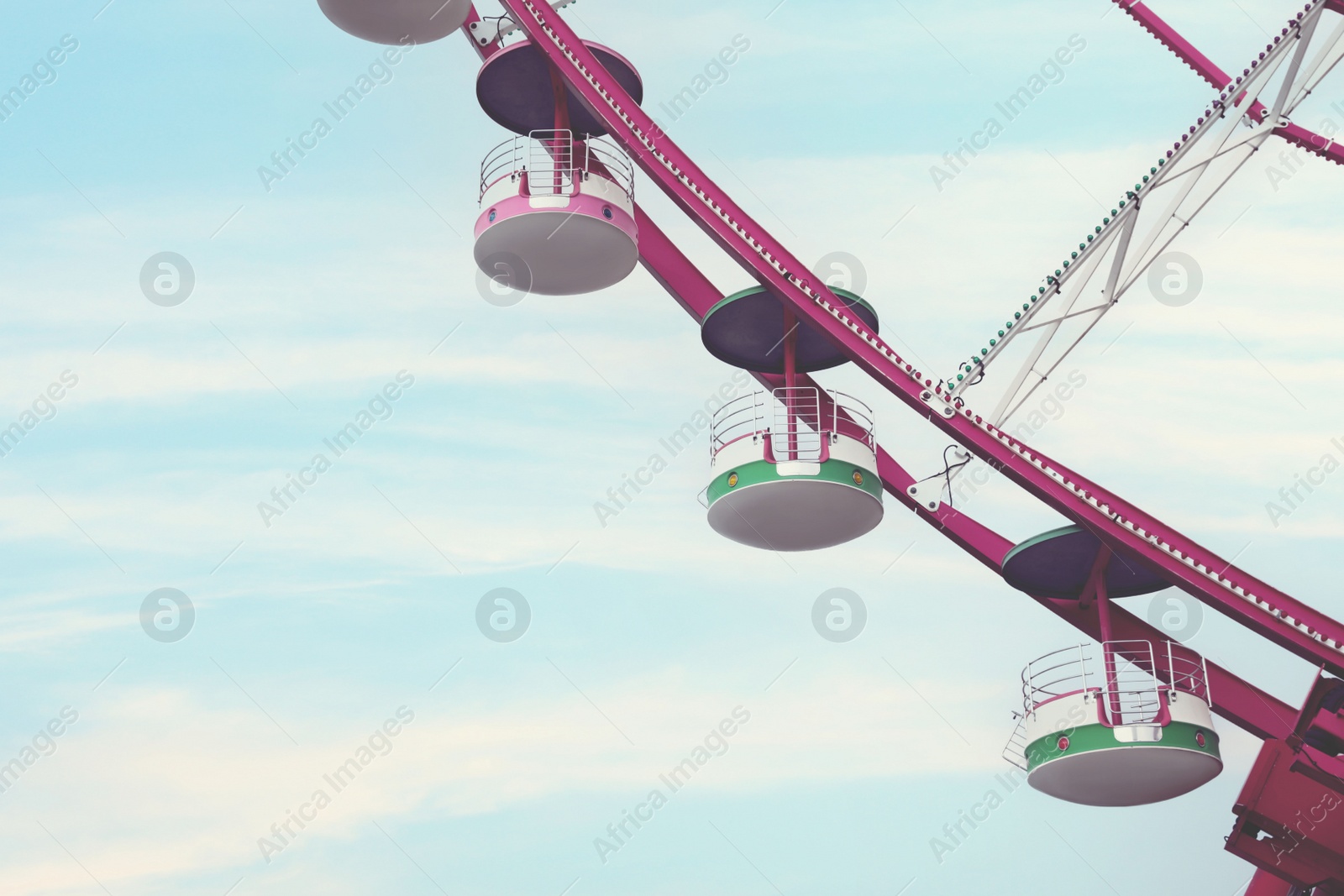 Image of Beautiful large Ferris wheel outdoors, space for text