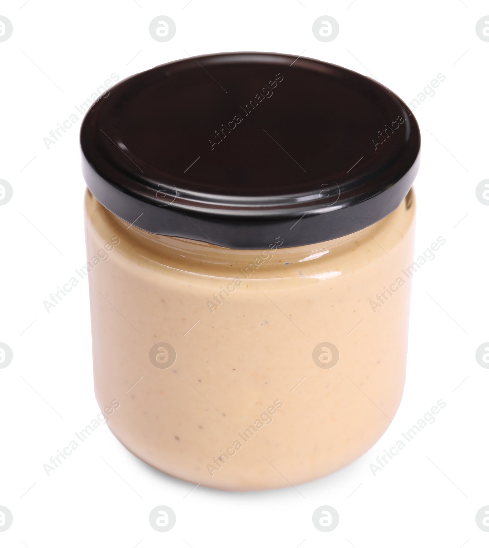 Photo of Tasty nut paste in jar isolated on white