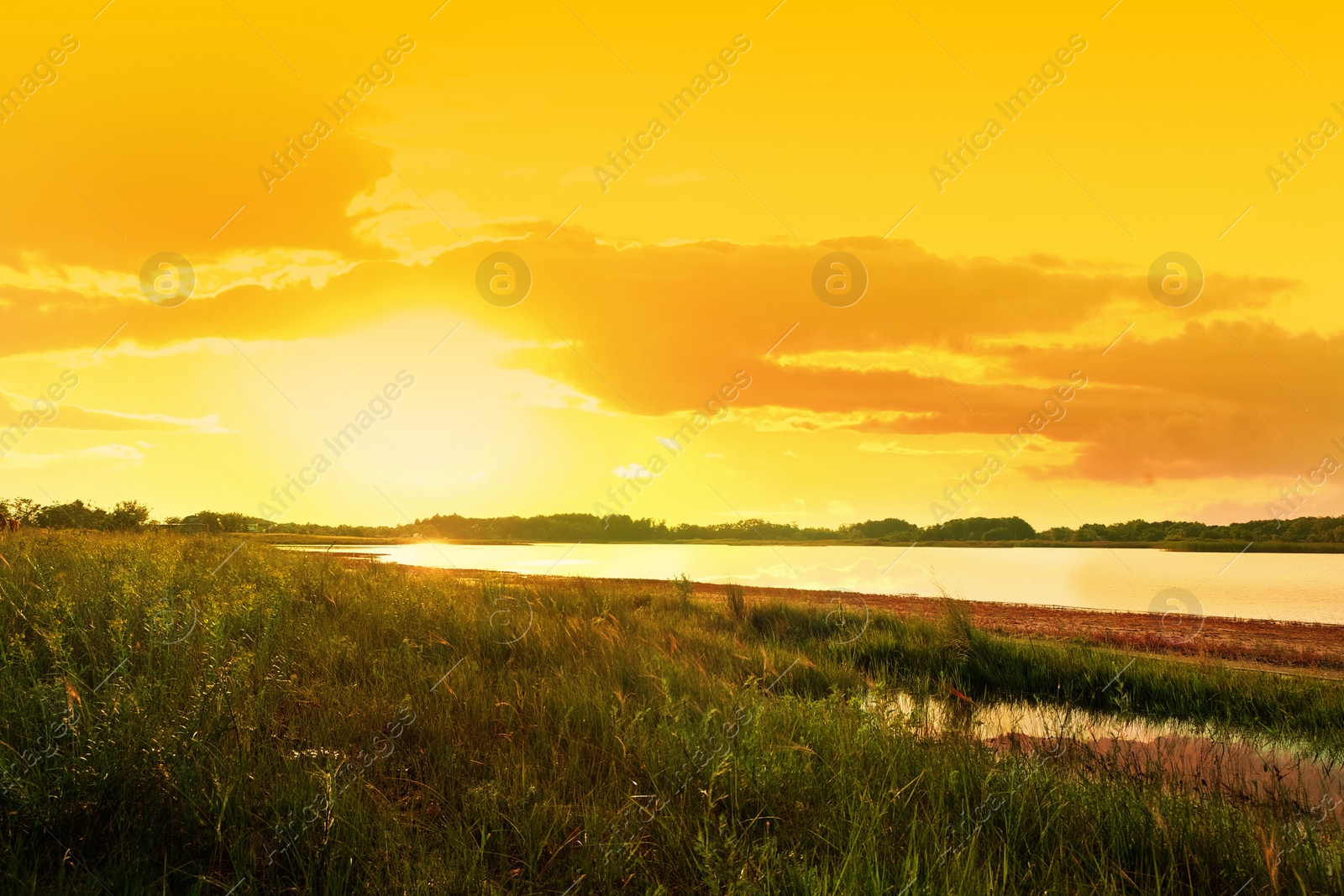 Image of Picturesque view of beautiful lake at sunset