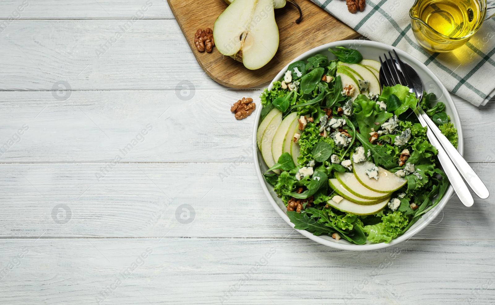 Photo of Fresh salad with pear on white wooden table, flat lay. Space for text