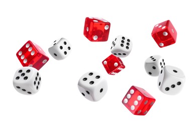 Image of Many different dice in air on white background