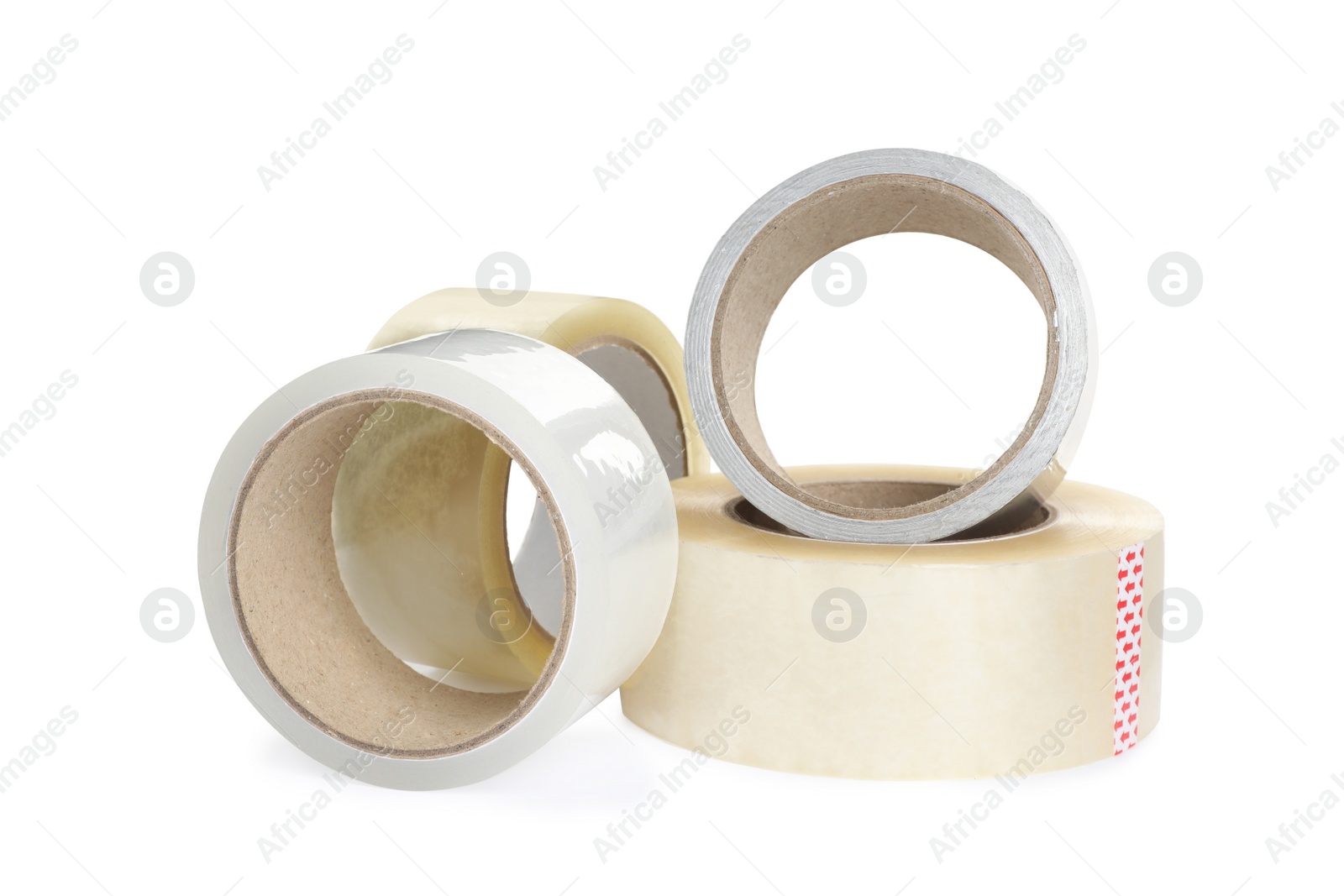 Photo of Many different rolls of adhesive tape on white background