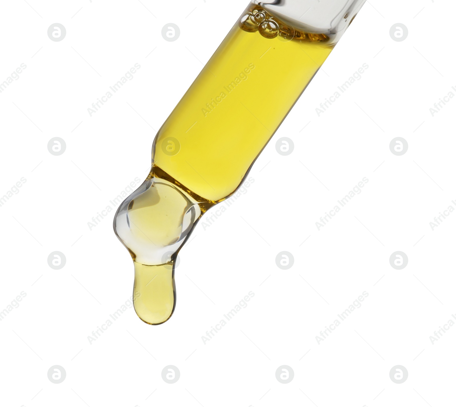 Photo of Dripping tincture from pipette isolated on white