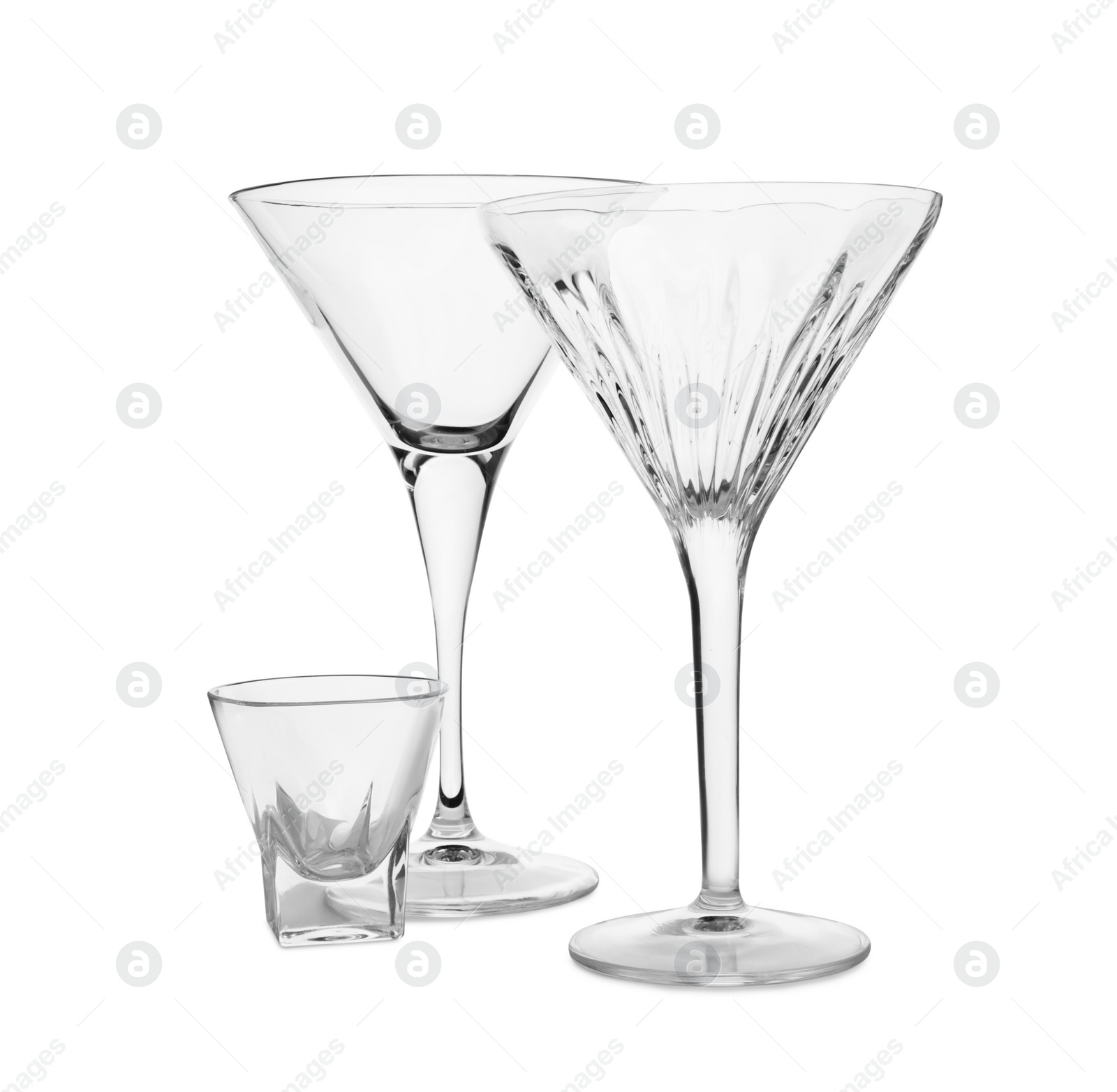 Photo of Elegant empty martini and shot glasses isolated on white