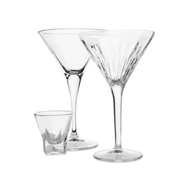 Photo of Elegant empty martini and shot glasses isolated on white