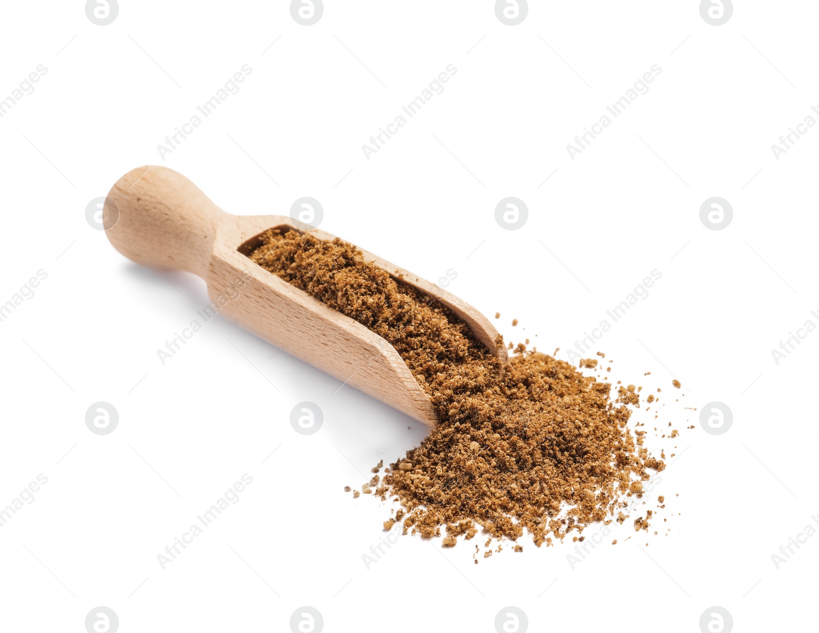 Photo of Wooden scoop of aromatic caraway (Persian cumin) powder isolated on white