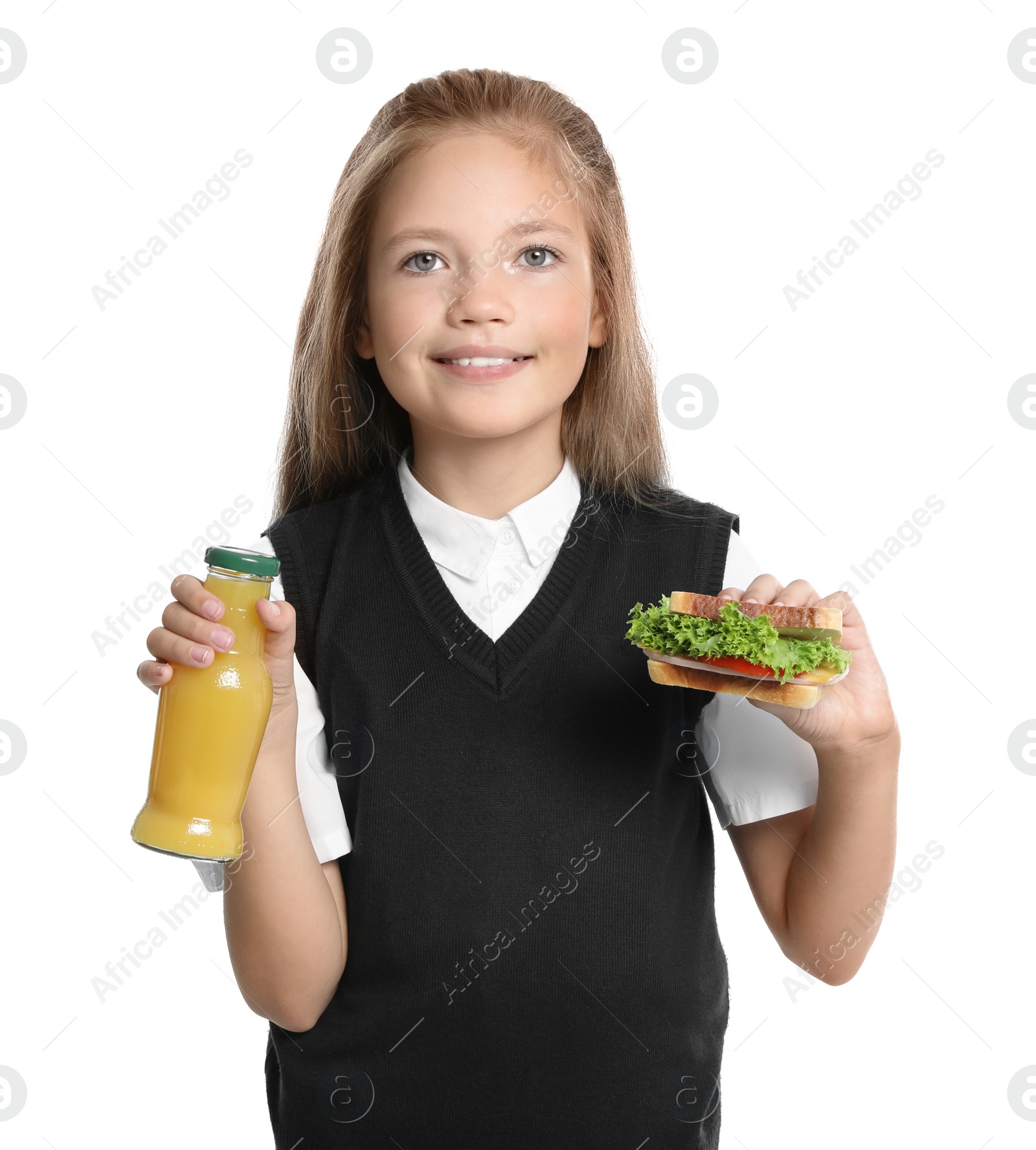 Photo of Happy girl holding sandwich and bottle of juice on white background. Healthy food for school lunch