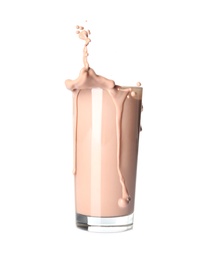 Photo of Glass with splashing chocolate milk on white background. Dairy drink