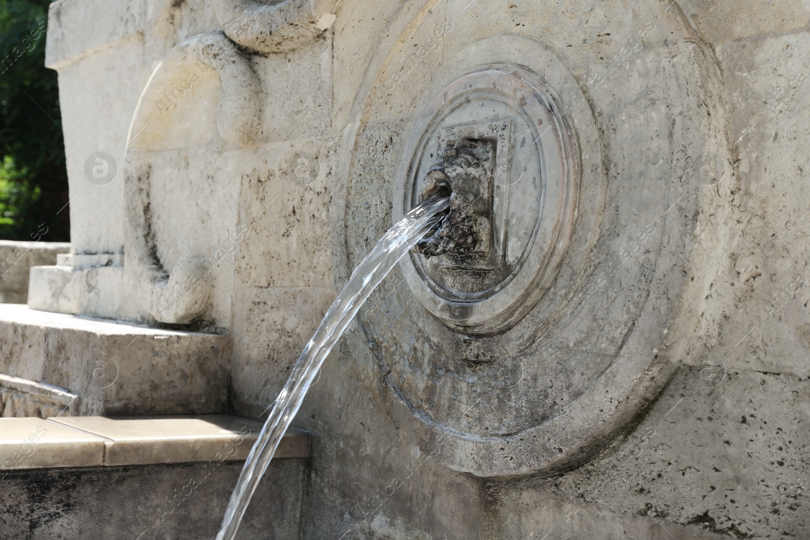 Photo of View of beautiful wall fountain on sunny day