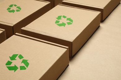 Image of Cardboard boxes with recycle sign stamps on paper