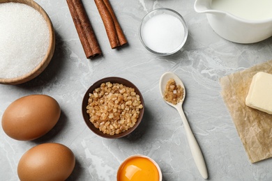 Photo of Flat lay composition with fresh ingredients for delicious homemade cake on light grey marble table