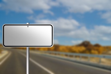 Image of Blank road sign on empty asphalt highway, space for text