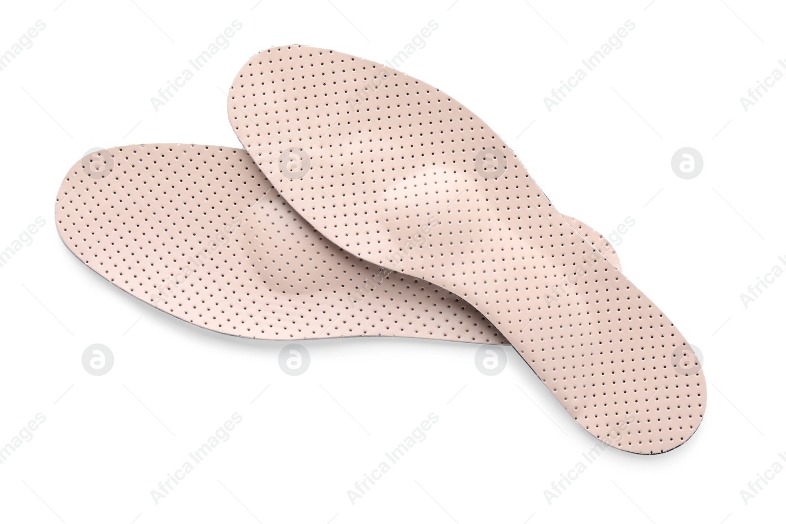 Photo of Beige orthopedic insoles isolated on white, top view