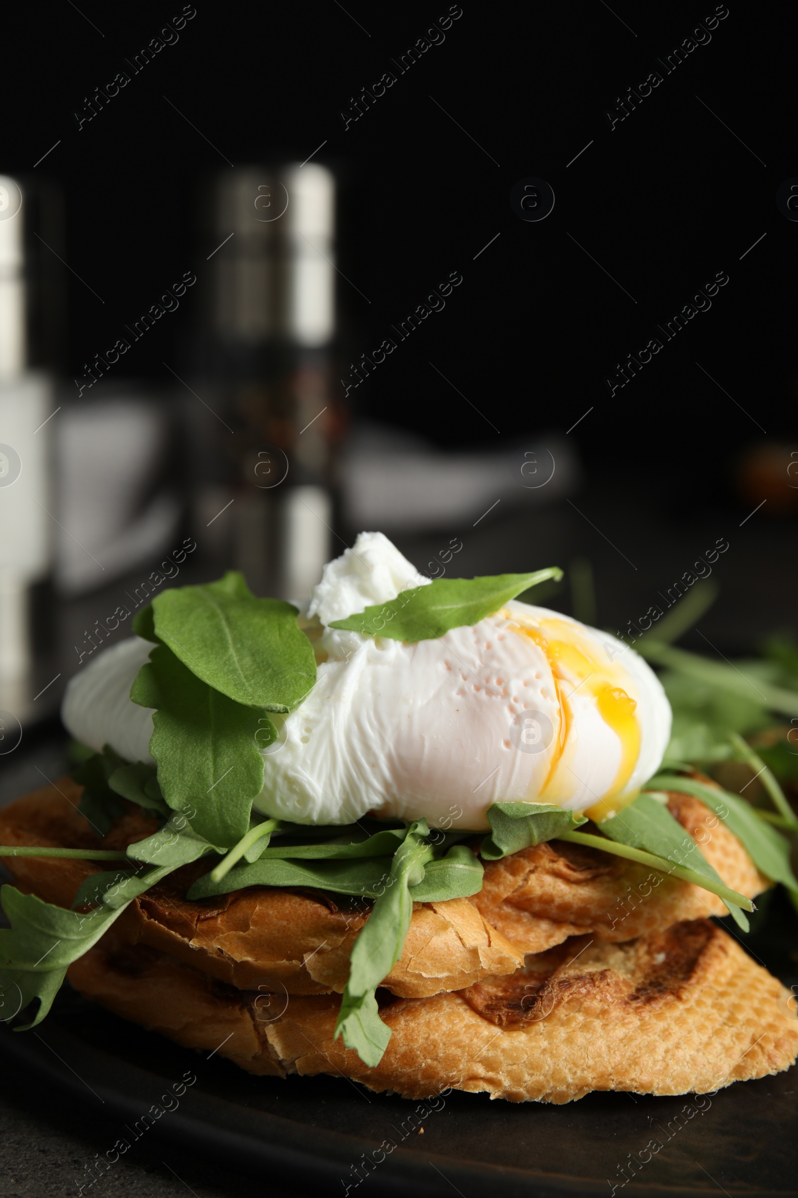 Photo of Delicious sandwich with arugula and egg on table, closeup