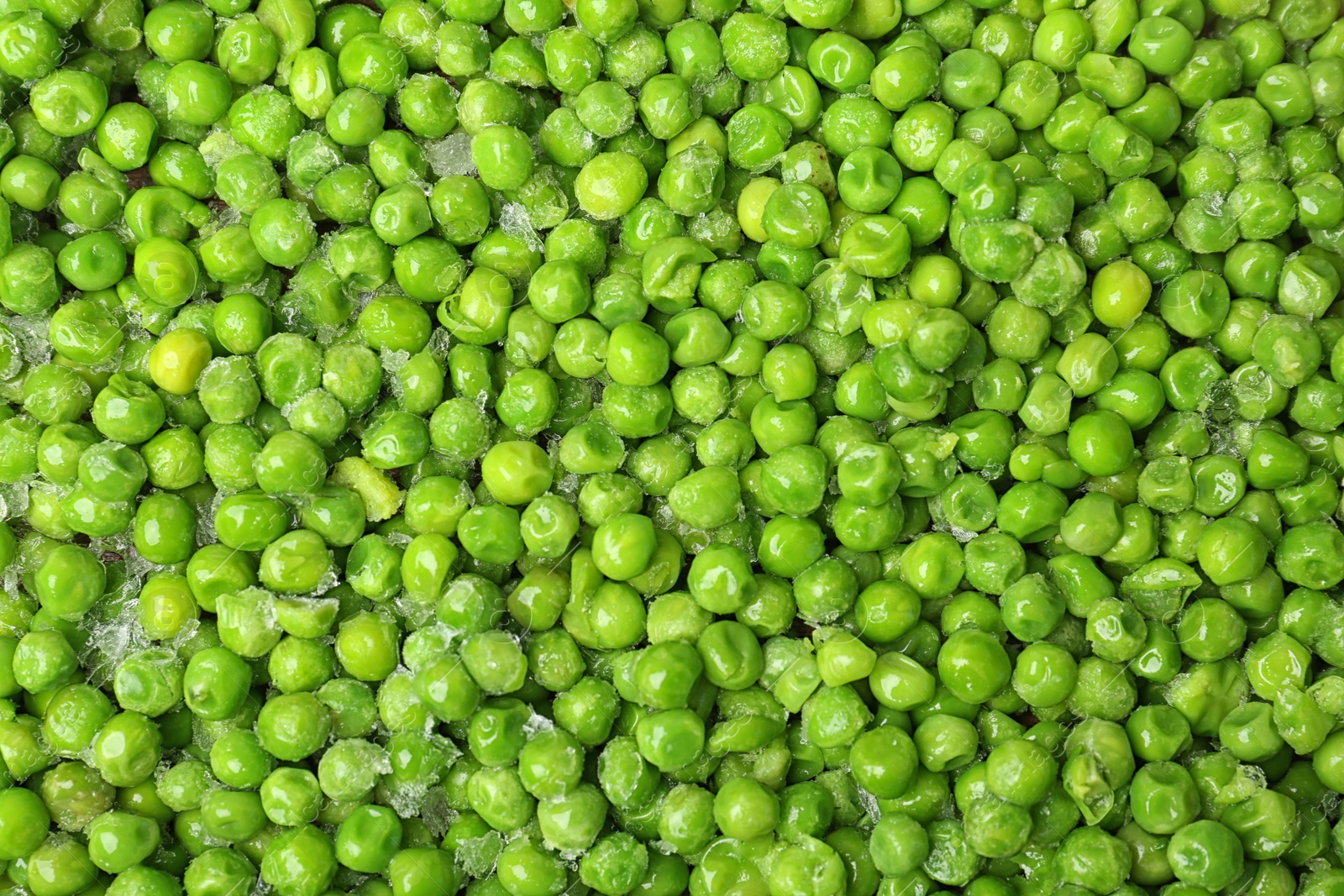 Photo of Frozen peas as background, top view. Vegetable preservation