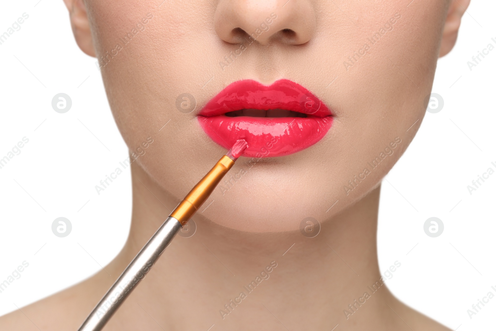 Photo of Woman applying lip gloss on white background, closeup