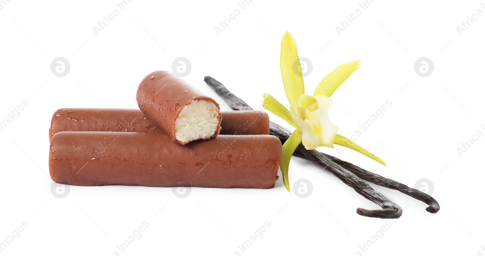 Photo of Glazed curd cheese bars, vanilla pods and flower isolated on white