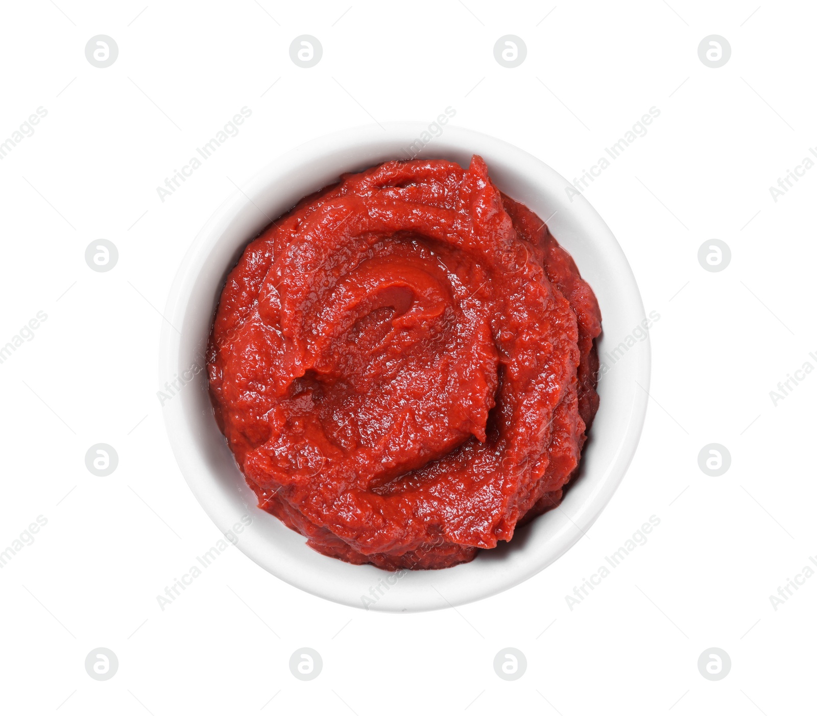 Photo of Bowl of tasty tomato paste isolated on white, top view