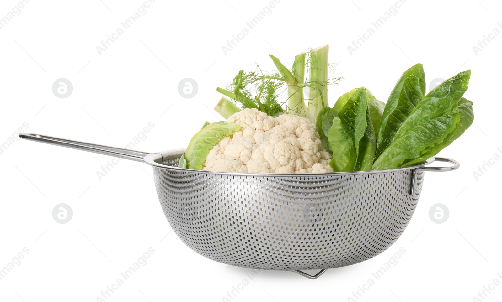 Photo of Metal colander with cauliflower, fennel and lettuce isolated on white