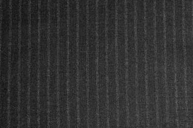 Photo of Texture of dark striped fabric as background, closeup