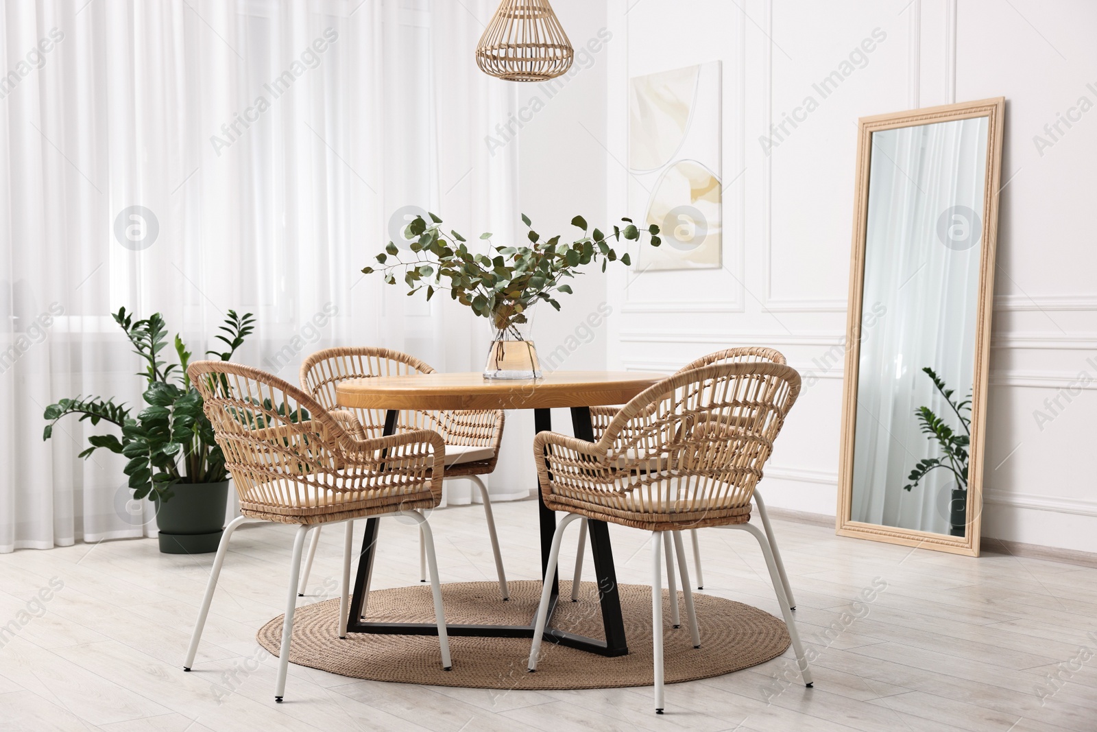 Photo of Dining room interior with comfortable furniture and plants