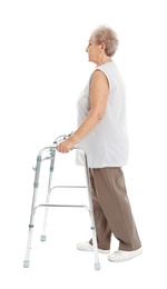 Photo of Full length portrait of elderly woman using walking frame isolated on white