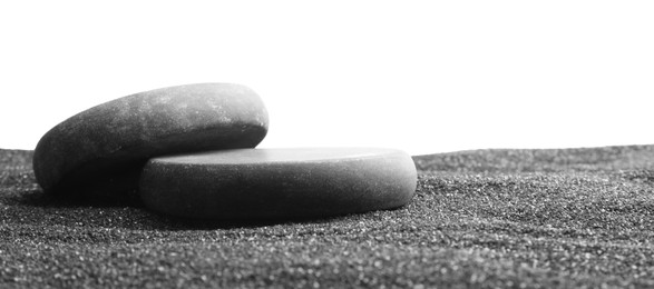 Photo of Presentation of product. Stone podiums on black sand against white background